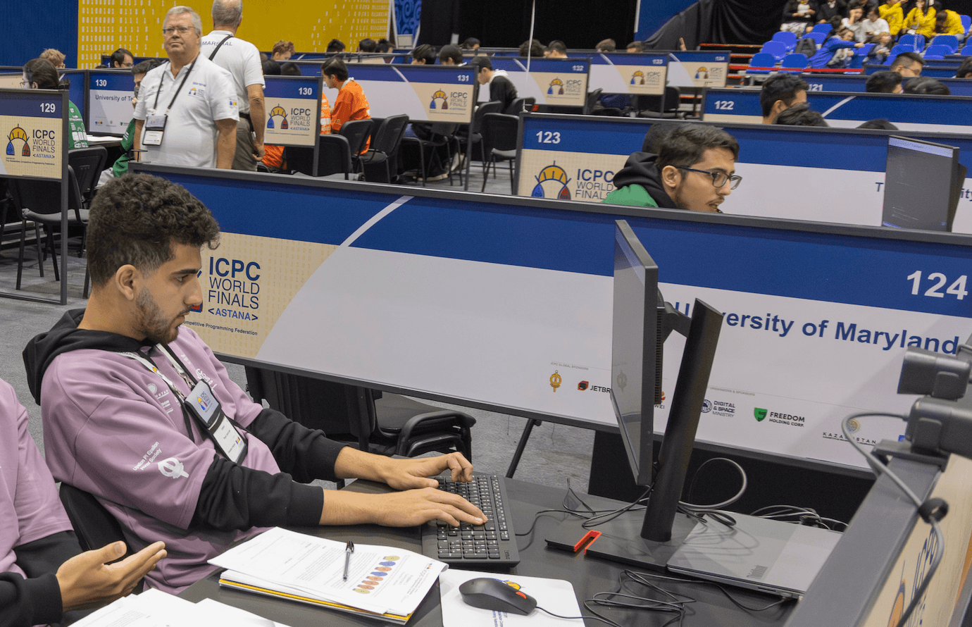 ICPC competitive programming team collaborating on algorithmic problems